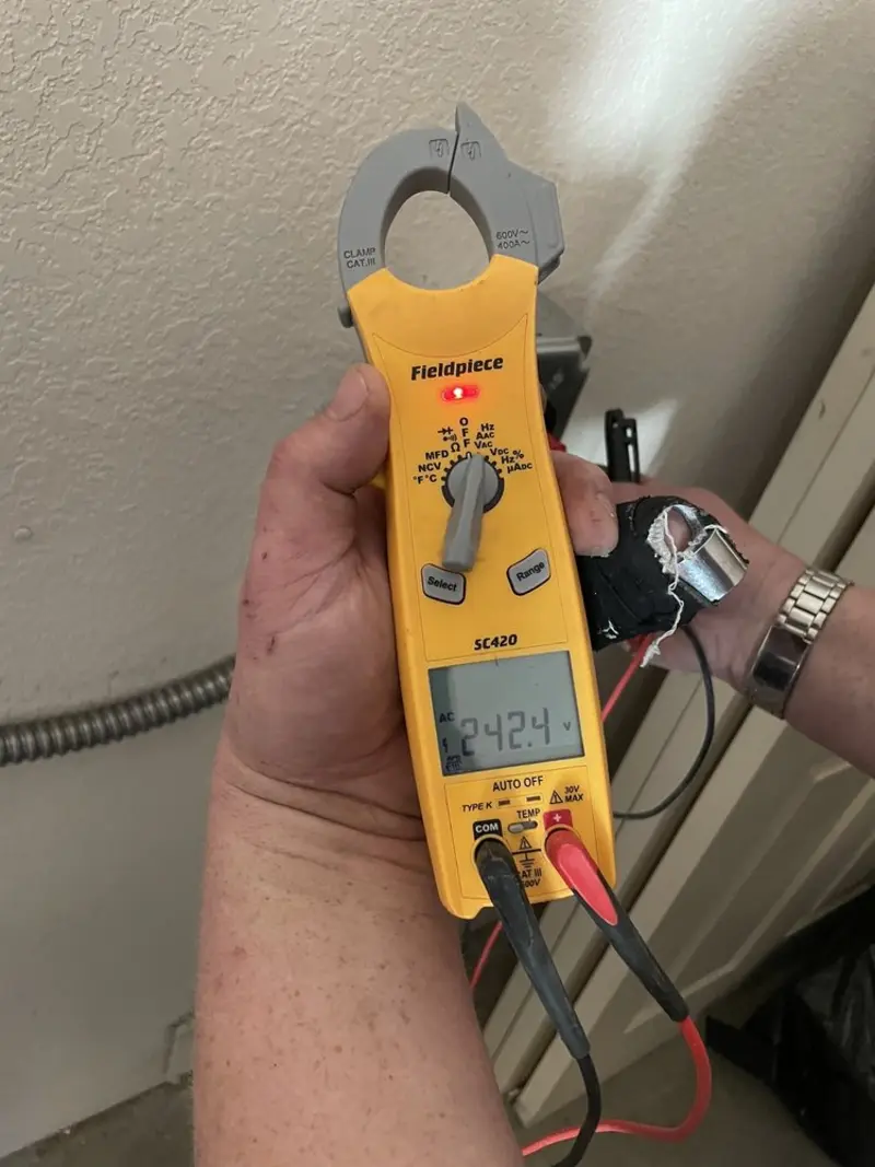 Voltage testing with clamp meter during Generator Installation in Shasta Lake